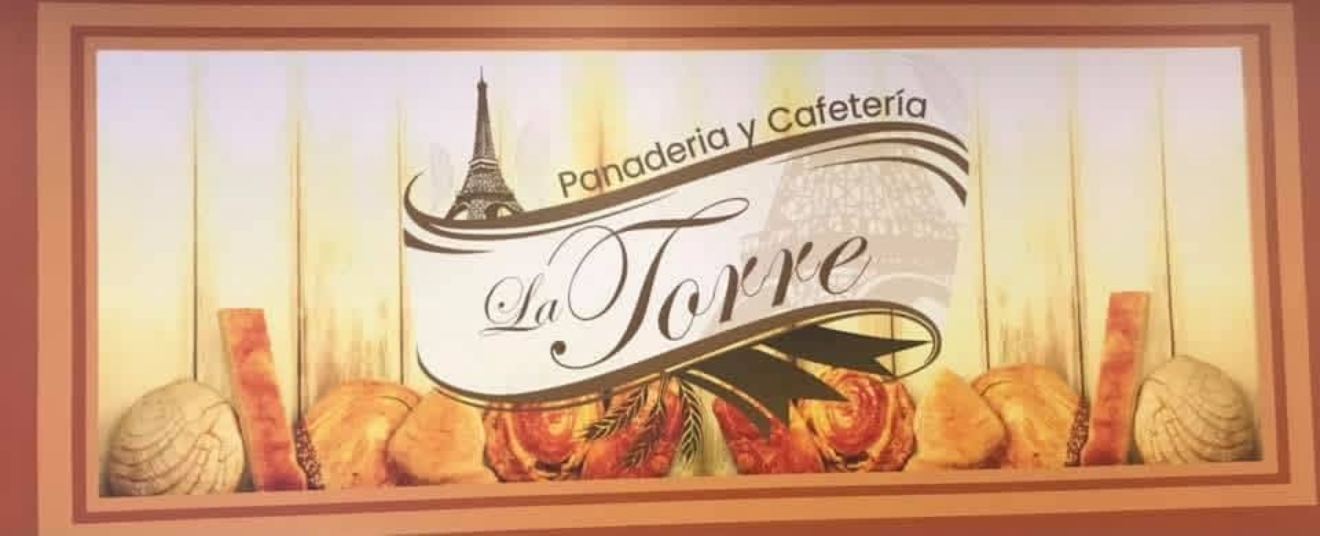 Letrero de Panadería y Cafetería La Torre en el local